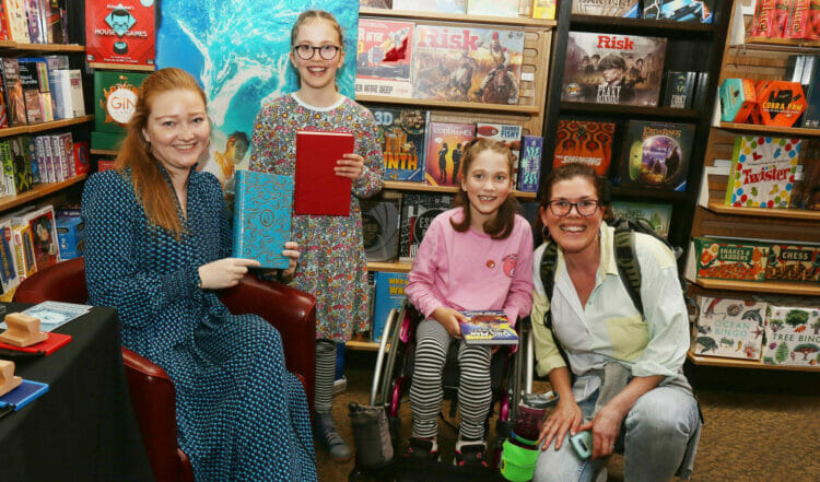Author AF Steadman with Nieve and Phoebe, both 9, as they collect their copies. Picture: Dijana Capan/DVision Images