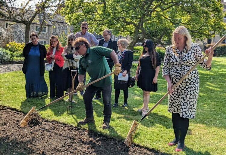 Head gardener Roland Staines preparing the soil with Cllr Rachel Eden. Picture: Jake Clothier