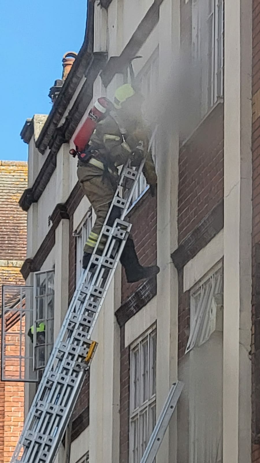 Fire crews on a ladder