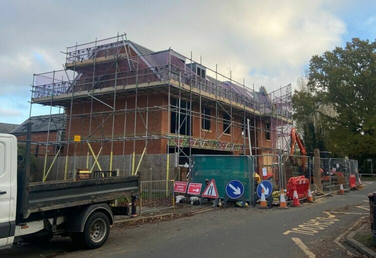Construction well underway to build retail space and four apartments on a grassy patch next to 114-116 School Road in Tilehurst Picture: Local democracy reporting service