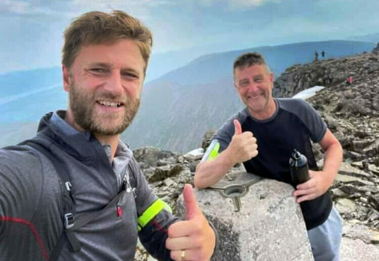 Mark Ashwell and his son, Matt, scaling one of the peaks. Picture: Courtesy of Mark Ashwell