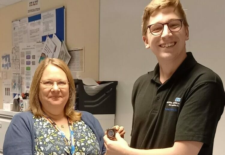 Debbie Fulton, Director of Nursing and Therapies at Berkshire Healthcare NHS Foundation Trust,  presents Jordan Herrington with NHS England Chief Nursing Officer Healthcare Support Worker  Award badge.