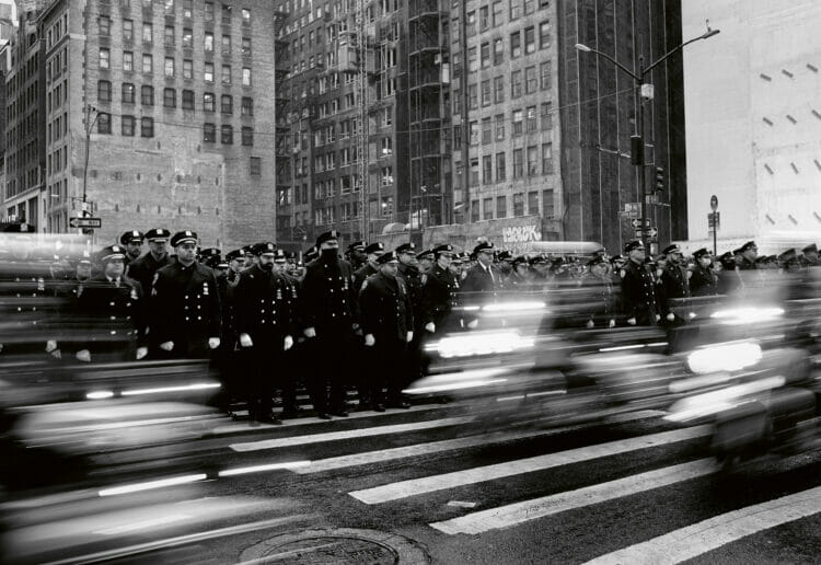 Picture taken of police at a funeral for a fallen brother on 5th Avenue in New York City.