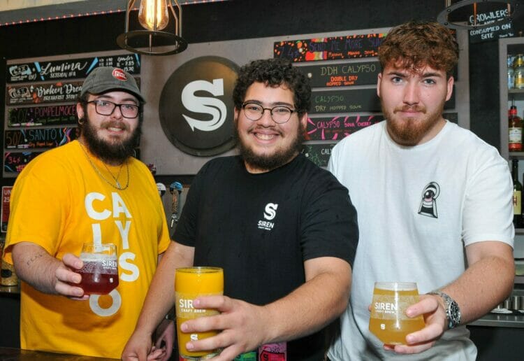 The Siren Craft Brew "Sessions and Sours" Event on Saturday.
Friendly staff members, Matthew Menear, Oliver Merrett and Harvey Web raise a glass.Picture: Steve Smyth