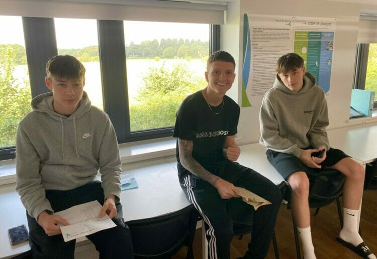 Joe, Ben, and Olly collecting their results. Pictures: Courtesy of Theale Green School