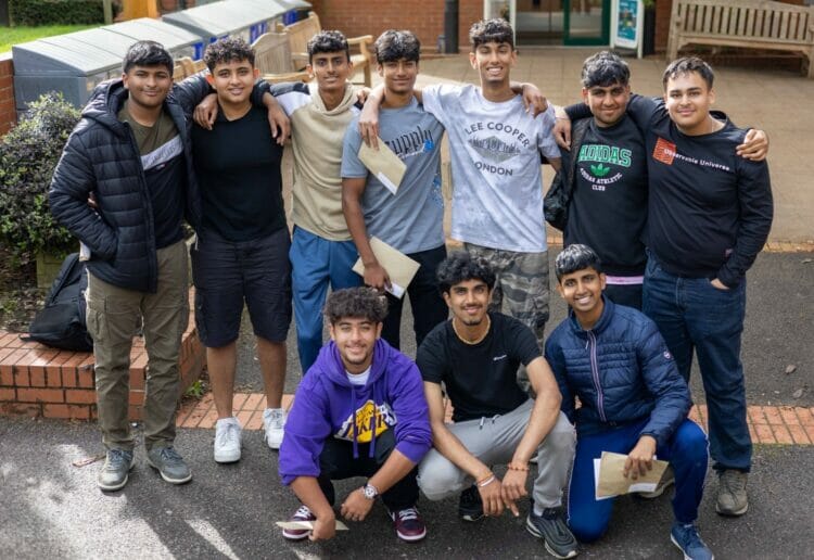 Students from Reading School celebrate receiving their GCSEs