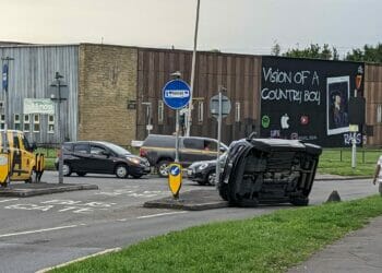 Car overturned at Cow Lane roundabout