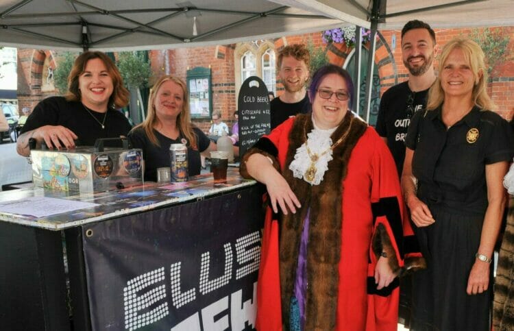 The Elusive Beer launch at Wokingham Market on Saturday, aided by Wokingham Town Mayor Cllr Sally Gurney Picture: Steve Smyth