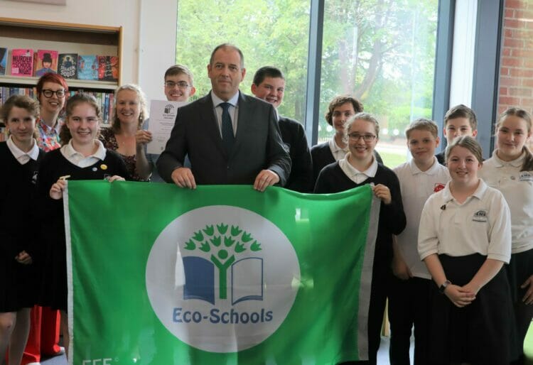 Little Heath School has been awarded Green Flag Accreditation for its efforts to reduce its environmental impact (Pictured: Head David Ramsden, centre, with pupils). Picture: Little Heath School