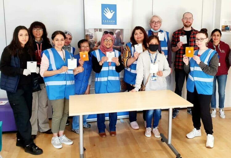 Volunteers from Sadaka distributed clothing vouchers to disadvantaged children. Picture courtesy of Sadaka.