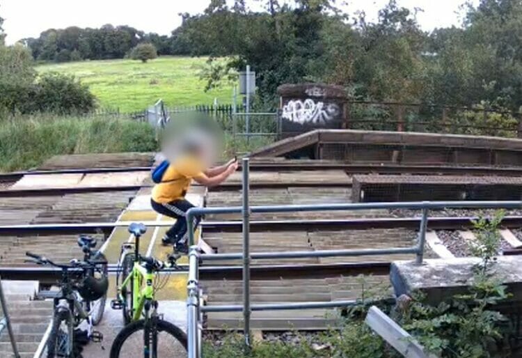 People trespassing on the railway at Calcot Mill.