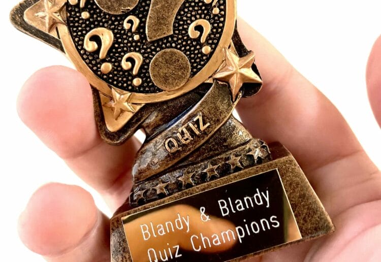 The winning team received a trophy from Blandy & Blandy
