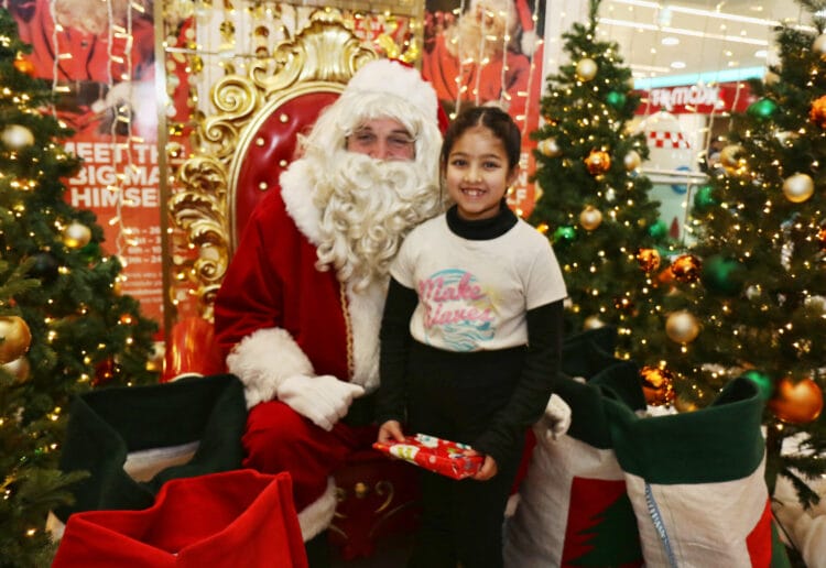 Santa with eight-year-old Hrudya at Broad St. Mall Picture: Dijana Capan/DVision Images