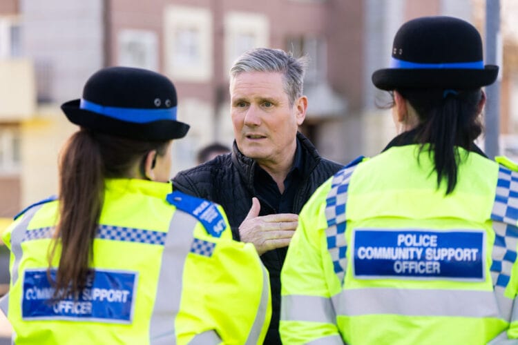 Keir Starmer, leader of the Labour Party, speaks to police officers during a visit to an area affected by anti social behaviour in Reading Picture: Labour Party