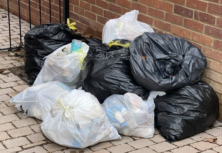 Bags of waste left outside the new Arthurd Hill apartments in Reading. Although these weren't fly-tipped, Reading Borough Council says it will take action on those who dump waste on streets
