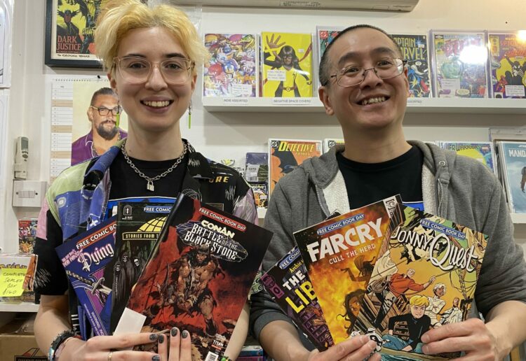 Marking Free Comic Book Day at Crunch Comics in Reading's Harris Arcade  are assistant manager Bryce and owner Brian Picture: Crunch Comics
