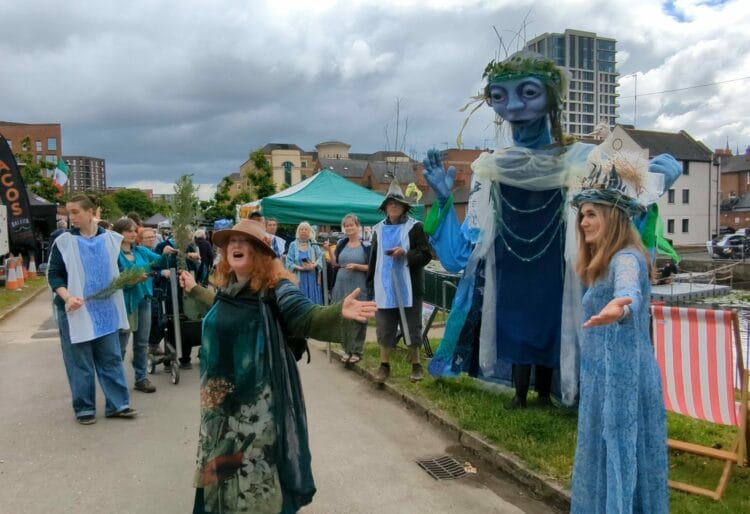 The Water Goddess, a giant puppet, taking part in a ceremony honouring the role of water in our lives. Picture: Jake Clothier