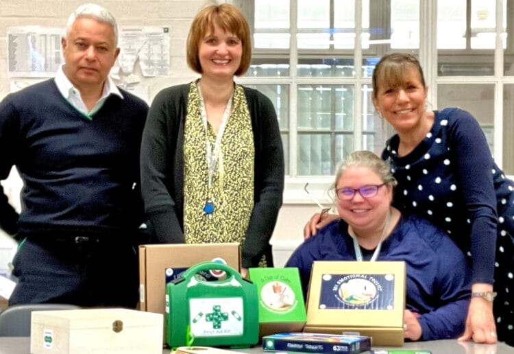 LtoR Specsavers  director Ravi Bhardwaj with Wilson Primary EY lead Jo Goodwill and EY teacher Jo Ninks (seated) with Cups of Calm founder Mitch Pinkney