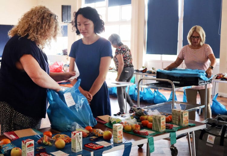 Tyan Yang helps to pack lunches at Woodley Lunch Bunch. Pic: Yuan Yang.