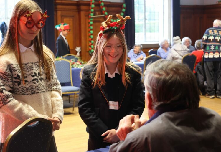 Year 8 students from Leighton Park welcomed guests from Age UK Reading to their Christmas Extravaganza. Picture: Leighton Park School