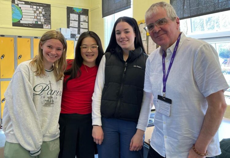Andrew with members of the journalism club at Kendrick school.