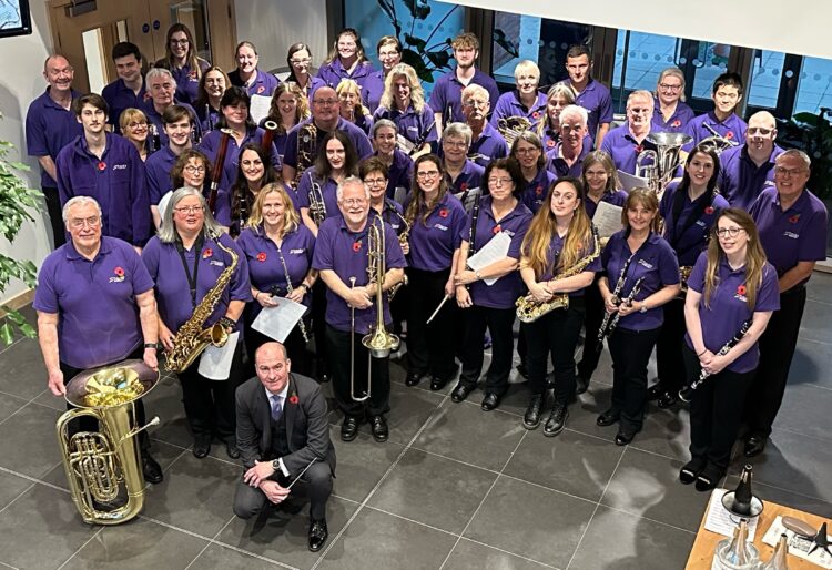 Trinity Concert Band celebrates platinum success. Concert manager and E flat clarinettist stuart Freebody proudly holds the award. Picture courtesy of Trinity Concert Band