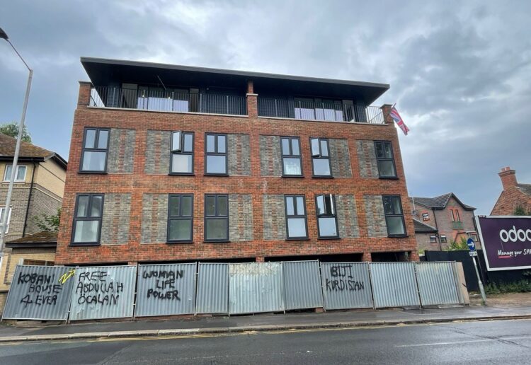 Pro-Kurdistan graffiti at the block of 11 flats that have replaced The Red Lion pub in Southampton Street near Reading town centre. Credit: James Aldridge, Local Democracy Reporting Service