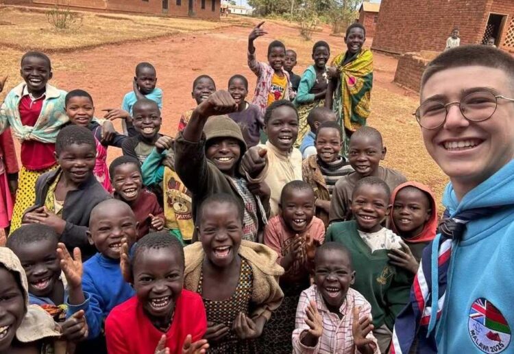 Lorenzo received news of his excellent results while on a volunteering expedition in Malawi. Pictures courtesy of RBC School