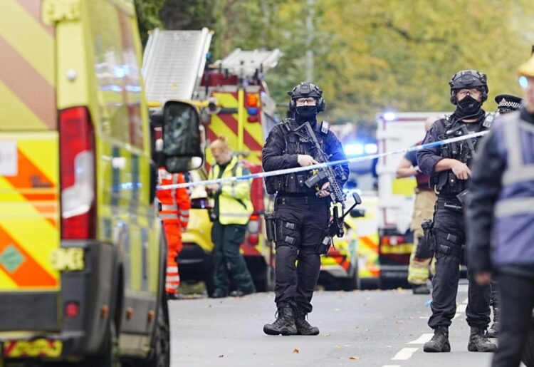Armed police officers at the scene of an incident at Heaton Park Hebrew Congregation synagogue in Crumpsall, Manchester, where police have shot a suspect after several people were stabbed and a car was driven at members of the public (Peter Byrne/PA)
