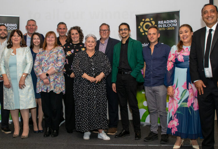 Reading in Bloom's sponsors at the awards event.