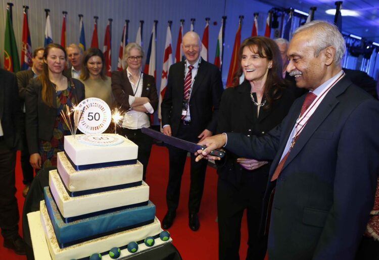 Florence Rabier (Director-General of ECMWF, second from right) and Rohit Tanna (Deputy Lieutenant of Berkshire, right) cut the 50th anniversary cake during the anniversary reception at ECMWF headquarters in Reading. Picture: Philip Hollis