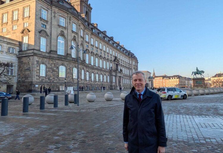 Matt Rodda, Labour MP for Reading Central, with Christiansborg Palace in Copenhagen in the background during his visit to Denmark. Credit: Office of Matt Rodda MP