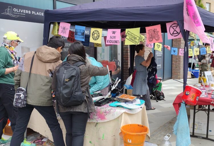 The busy Extinction Rebellion stall at Reading Water Fest, within the Huntley Wharf development. Credit: Extinction Rebellion Reading