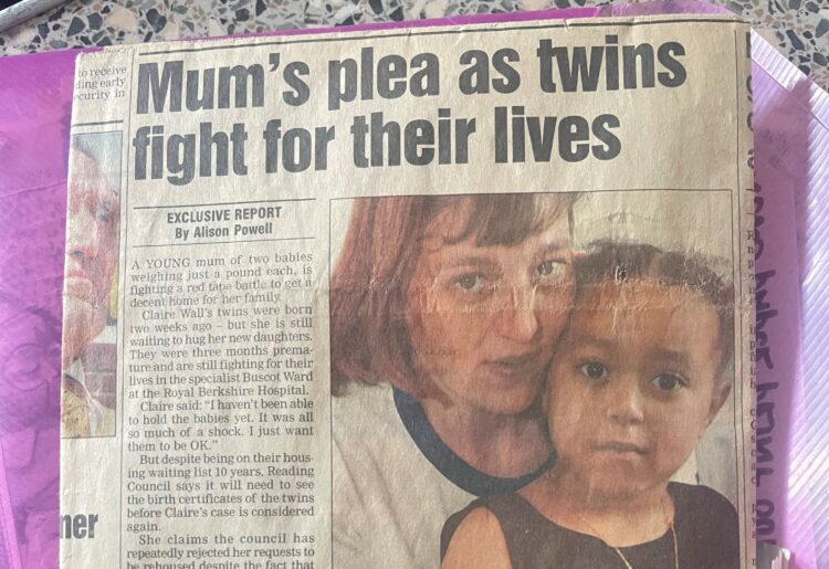 A newspaper clipping showing Claire Wall-Weeks, her daughter Brianna Wall-Weeks and the twins, one of which is Siereece, who faces eviction following the death of Claire