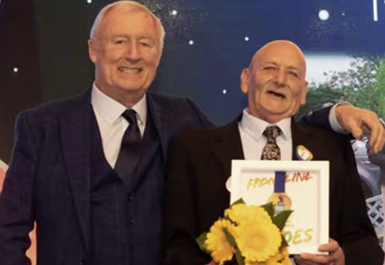 Ronnie (right) was given his Pride of Reading Award by television personality Chris Tarrant. Image: Dijana Capan.