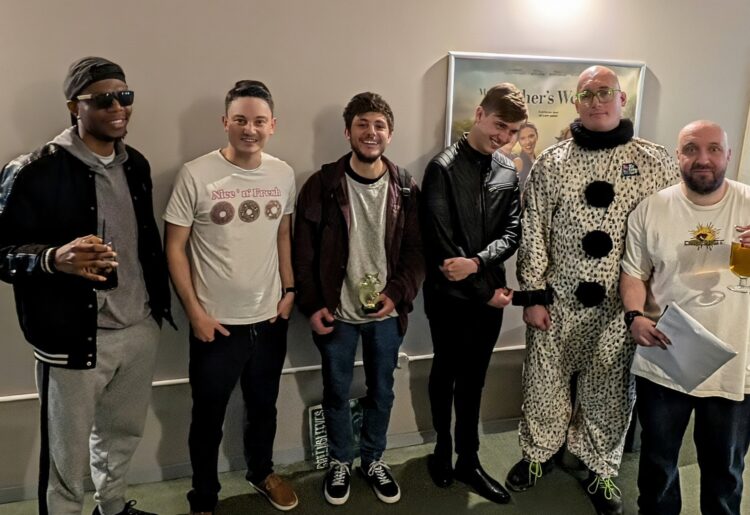 Reading Indie Comedy Festival has named its New Act of the Year for 2026. From left: Emmanuel Idemundia, host Rhodri Buttrick, winner Olly Miller, Alfie Nelson, Rob Duck, and Mates Rates' Carl Richard.