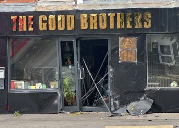 Police investigating vehicle collision which left Reading shopfront smashed open