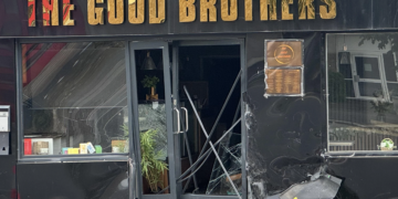 Police investigating vehicle collision which left Reading shopfront smashed open