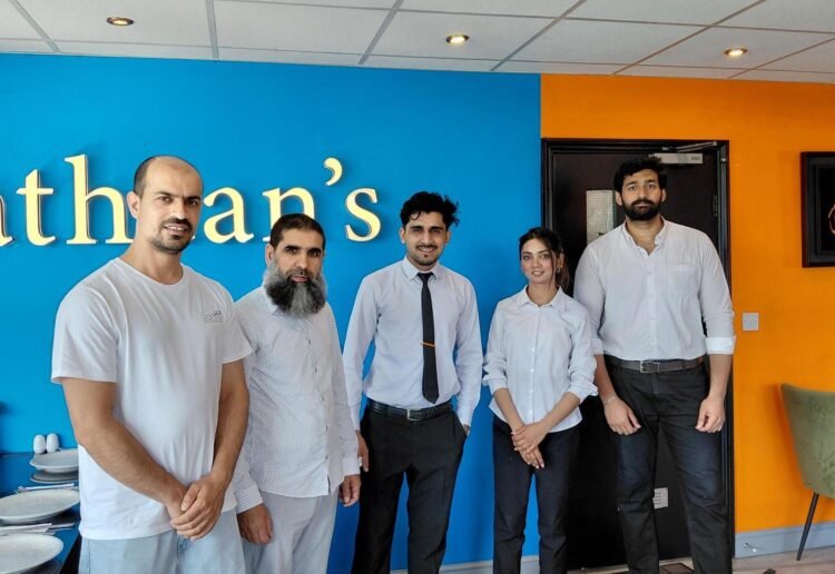 Sayed Esrar, left, with staff at Pathaan's Persian, Afghan and Pakistani cuisine restaurant in Bridge Street, Caversham. Credit: James Aldridge, Local Democracy Reporting Service
