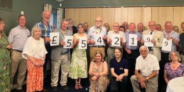 Dragons breathe thousands of pounds into charity