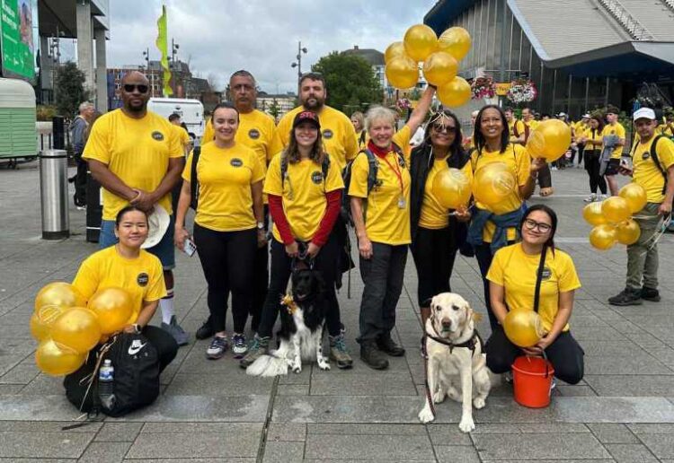 A group of Reading Buses employees, along with their friends and family, has smashed its fundraising goal in aid of Berkshire Search and Rescue Dogs, some of whom also joined them aat the event. Picture: Reading Buses