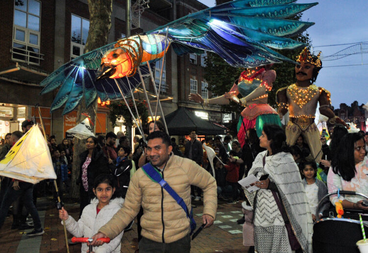 Carnival-style wooden puppets were displayed over the heads of those watching on. Picture: Steve Smyth